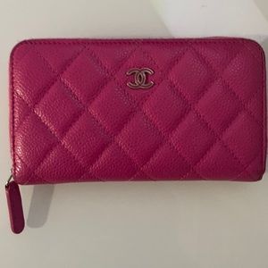 Authentic Chanel caviar quilted medium zip around wallet in pink color